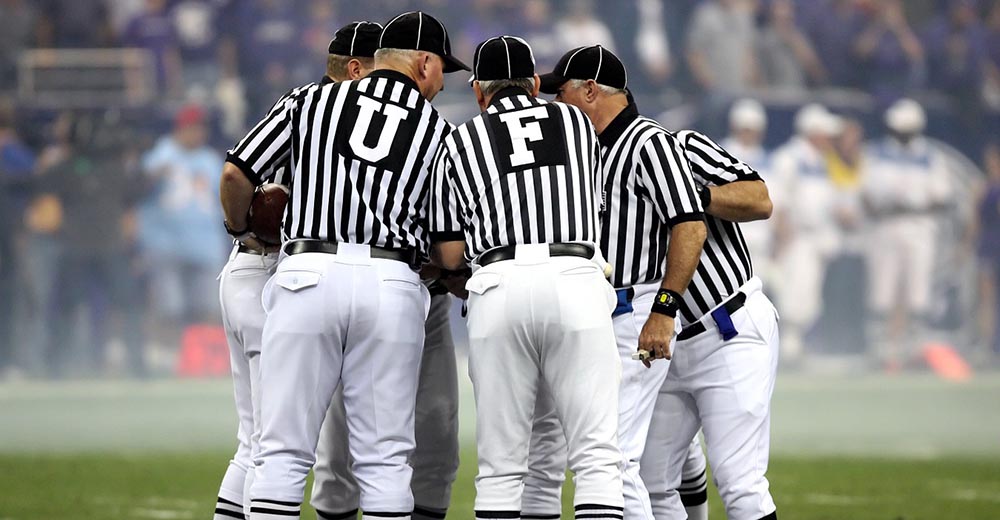 Football referee huddle.