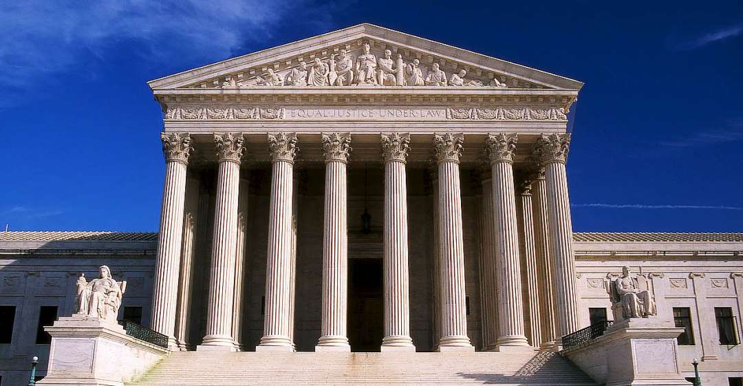 Courthouse under blue sky.