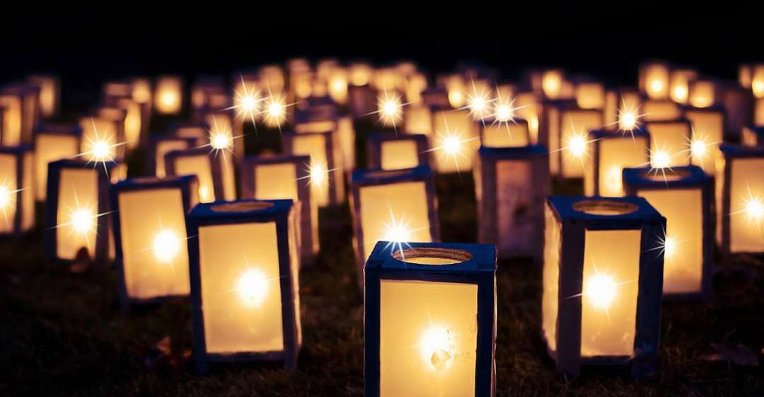 Multitude of candles on the ground.