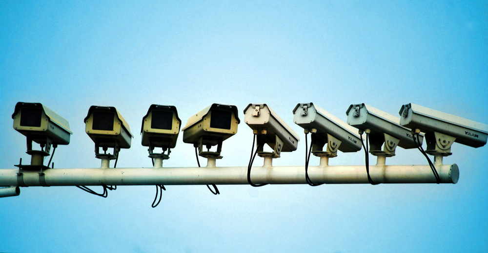 Line of surveillance cameras.