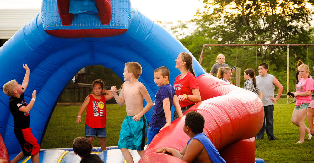 Children play on the blow up toys.