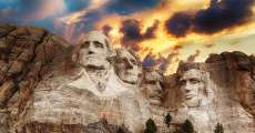 Mount Rushmore with clouds.