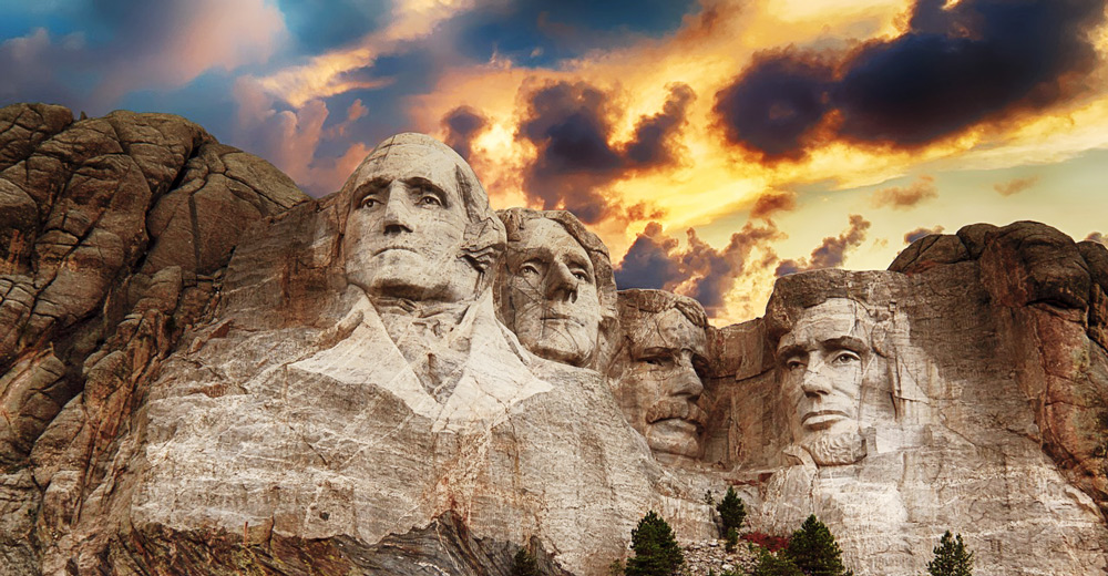 Mount Rushmore with clouds.