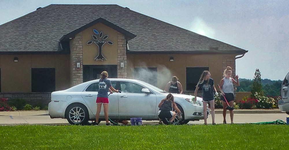 People washing cars in front of Southern Bank Alton Mo.