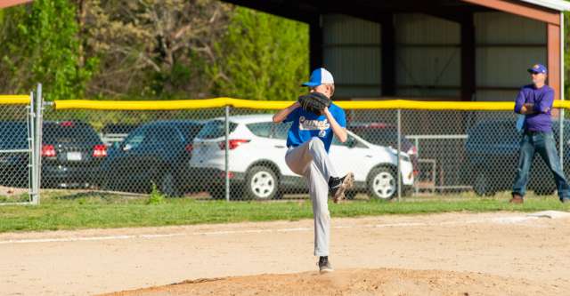 ALTON, MO – APRIL 26: Alton Comets pitcher winds up with the baseball during the high school baseball game between the Alton Comets and the Winona Wildcats on April 26, 2022, at the Alton High School baseball field in Alton, MO. (Photo by Curtis Thomas/AltonMo.com)