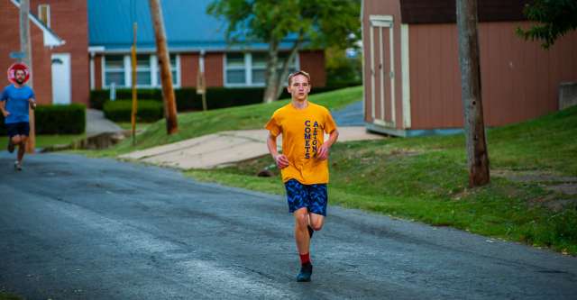 Run the Town for the Gold 5K runner.