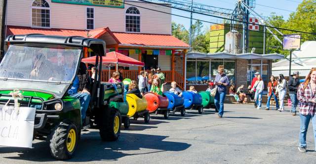 Kids enjoying a train ride around the square at the Walnut Festival on October 7, 2023.