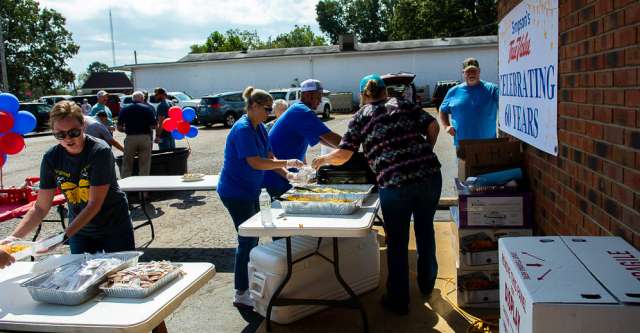 Volunteers dishing out food at Simpson's True Value.