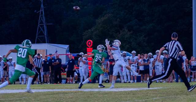 THAYER, MO – SEPTEMBER 6: Lighthouse Charger Aiden Lotter (4) catches a throw despite the defender during the high school football game between the Thayer Bobcats and the Lighthouse Christian Chargers on September 6, 2024, at the Thayer High School football field in Thayer, MO. (Photo by Amanda Thomas/AltonMo.com