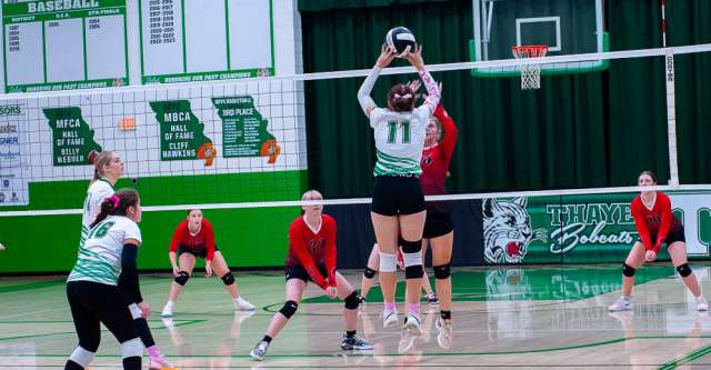 THAYER, MO – OCTOBER 10: A Thayer Bobcat player hits the volleyball over the net during the high school volleyball game between the Couch Indians and the Thayer Bobcats on October 10, 2024, at the Thayer High School Gym in Thayer, Missouri. (Photo by Amanda Thomas/AltonMo.com)