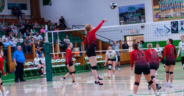 THAYER, MO – OCTOBER 10: A Couch Indian player spikes the ball over the net during the high school volleyball game between the Couch Indians and the Thayer Bobcats on October 10, 2024, at the Thayer High School Gym in Thayer, Missouri. (Photo by Amanda Thomas/AltonMo.com)