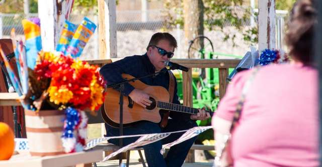 A guitarist providing music at the Heritage Day.