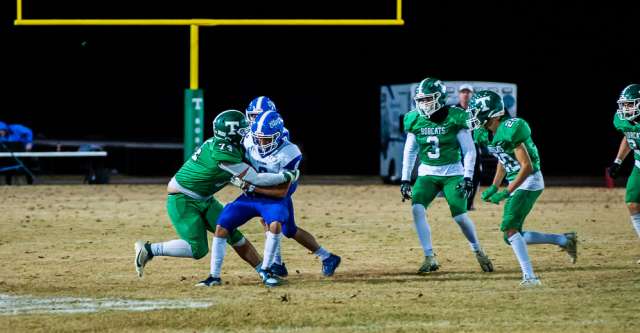 THAYER, MO – NOVEMBER 1: Thayer Bobcats defensive lineman Cooper Clark (74) tackles the opponent during the high school football game between the Thayer Bobcats and the Clever Bluejays on November 1, 2024, at the Thayer High School football field in Thayer, MO. (Photo by Curtis Thomas/AltonMo.com)