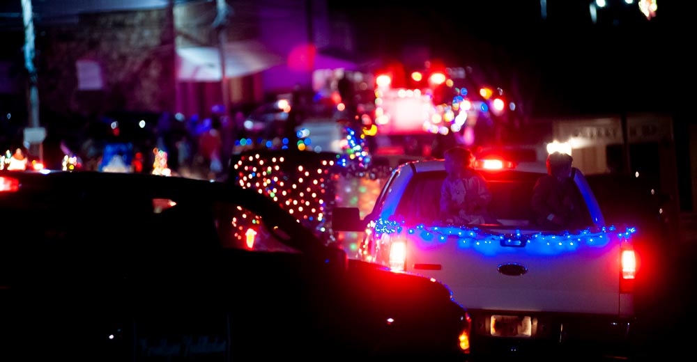 Decorated vehicles following the parade route.