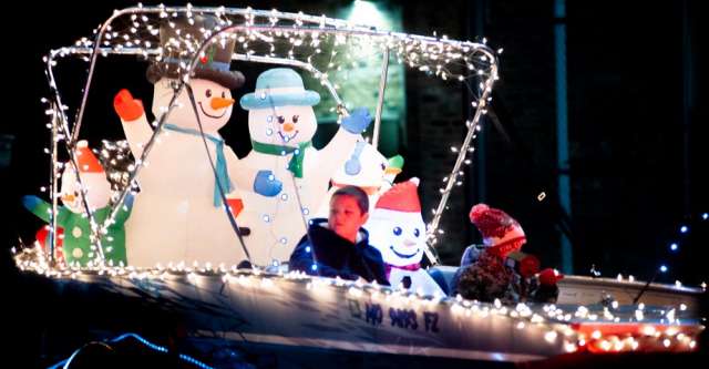 Blown up snowmen in a boat for Alton's Christmas parade.