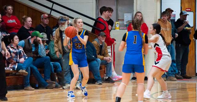 COUCH, MO – JANUARY 14: Alton Comets Lilly Haddock (23) looks to pass the ball during the high school basketball game between the Alton Comets and Couch Indians on January 14, 2025 at the Couch High School Gym in Couch, Missouri. (Photo by Amanda Thomas/AltonMo.com)