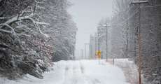 Highway AA in Alton, Missouri, is covered with snow.